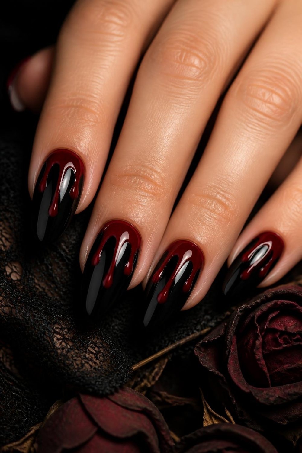 Black blood drip gothic nails with glossy red drips on black almond nails