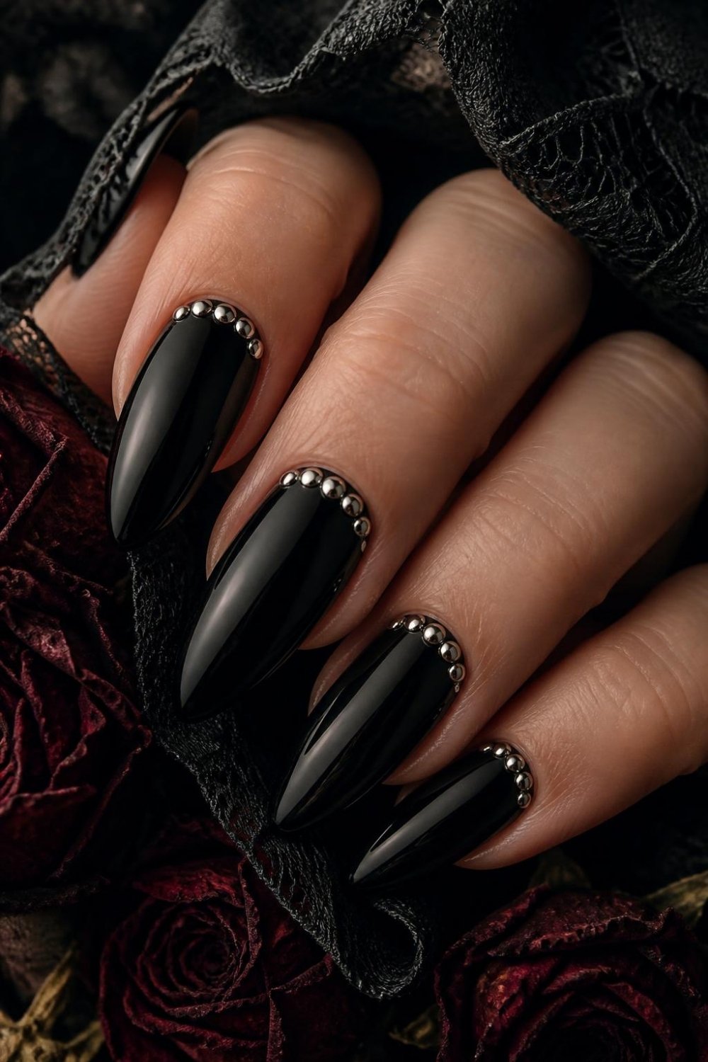 Black and silver stud gothic nails with metal studs at the cuticle