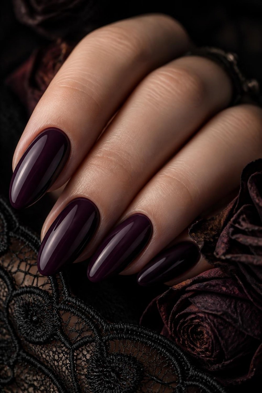 Dark plum gothic nails with glossy deep purple polish