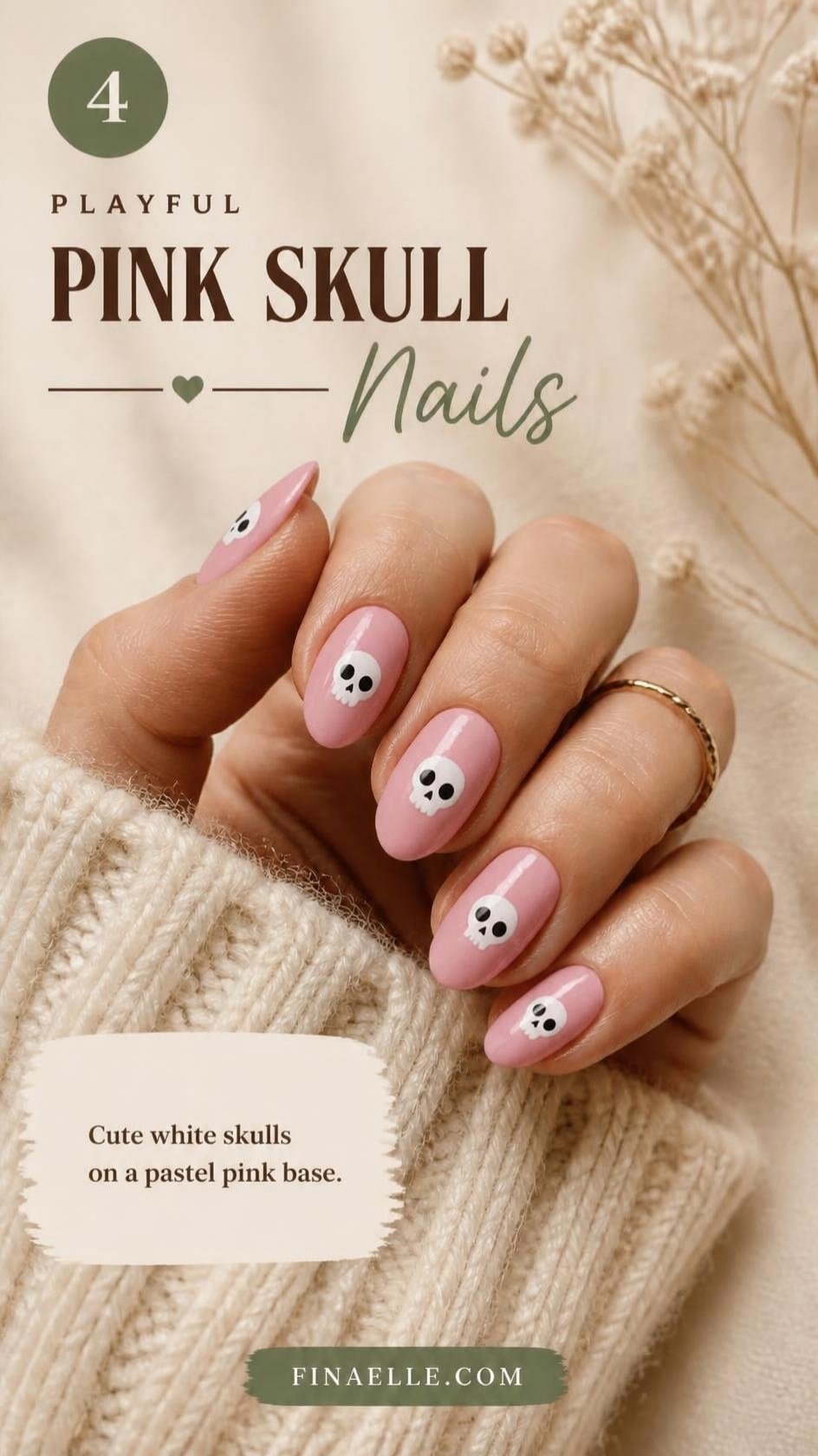 Pink skull Halloween nails with cute white skulls on pastel pink almond nails